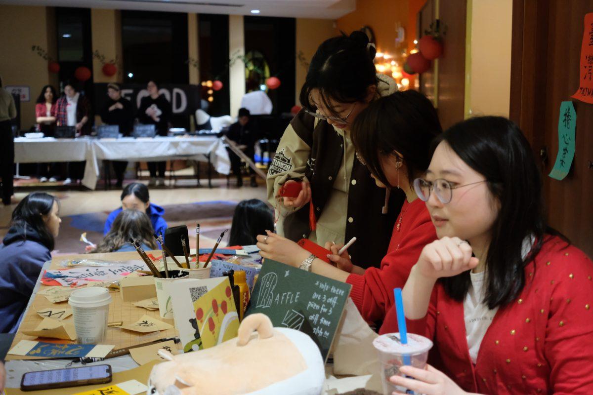 Vendors at the Night Market work the raffle booth.
Photo Courtesy of Olivia Hewang.