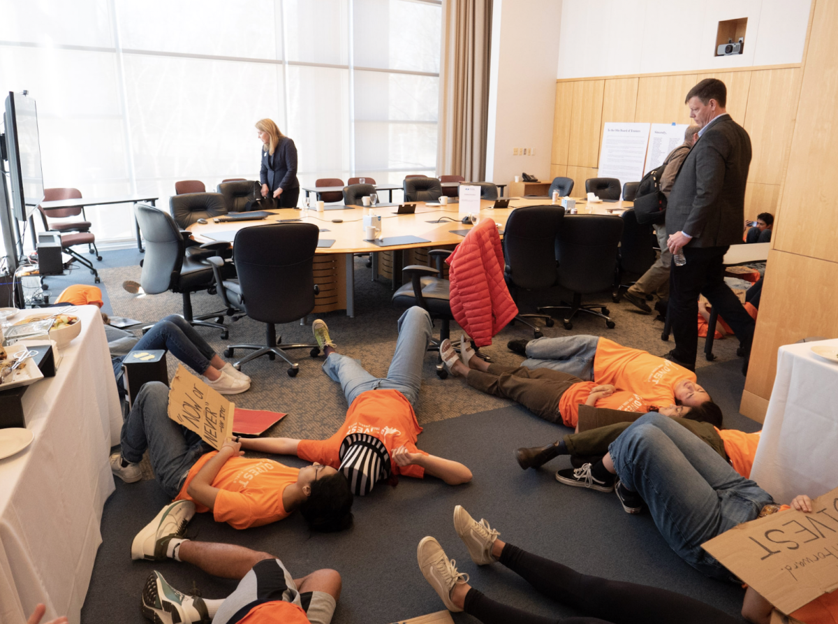 Student group, Divest Olin, interrupts Board of Trustees meeting.
Photo Courtesy of Brooke Moss